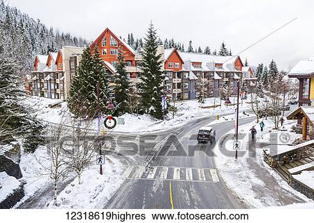 Stock Photograph - The Creekside village condos and lift entrance at the south end of Whistler mountain in British Columbia after fresh winter s0wfall; Whistler, British Columbia, Canada. Fotosearch