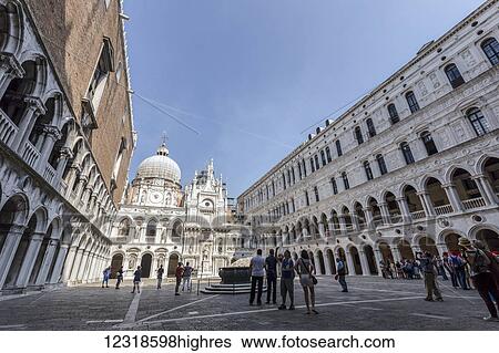 Stock Photograph - The interior Piazza of Doge's Palace, also k0wn as Palazzo Ducale in Italian, one of the many attractions for visitors to Venice and St Mark's Basilica; Venice, Italy. Fotosearch
