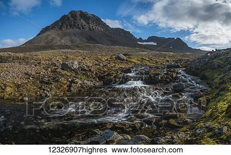 Stock Photograph - The mountains and streams of the Strandir Coast; West Fjords, Iceland. Fotosearch