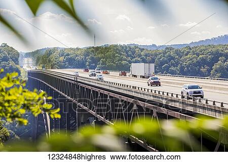 The New River Gorge Bridge, a steel arch bridge 3, 030 feet long over the New River Gorge near Fayetteville in the Appalachian Mountains of the eastern United States; West Virginia, United States of America View Large Photo Image Stock Photograph - The New River Gorge Bridge, a steel arch bridge 3, 030 feet long over the New River Gorge near Fayetteville in the Appalachian Mountains of the eastern United States; West Virginia, United States of America. Fotosearch