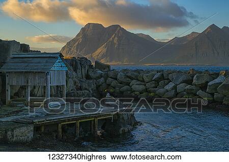 Stock Photograph - The old pier in Gjojur, a tiny fishing village along the Strandir Coast; Gjojur, West Fjords, Iceland. Fotosearch