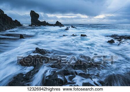 The pounding surf on the beach of Djupalon which is on the western tip of the Snaefellsness Peninsula; Iceland View Large Photo Image Stock Photograph - The pounding surf on the beach of Djupalon which is on the western tip of the Snaefellsness Peninsula; Iceland. Fotosearch