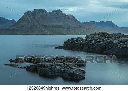 Stock Photograph - The Strandir Coast at dusk; Westfjords, Iceland. Fotosearch