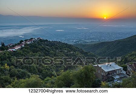 The sun is rising above Caucasus Mountains and the Alazani Valley; Georgia View Large Photo Image Stock Photograph - The sun is rising above Caucasus Mountains and the Alazani Valley; Georgia. Fotosearch