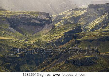Stock Photograph - The verdant green mountains of Iceland's South Coast; Iceland. Fotosearch