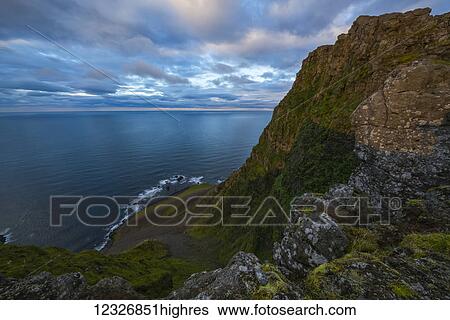 Stock Photograph - The view from the top of a sea cliff along the Strandir Coast; West Fjords, Iceland. Fotosearch