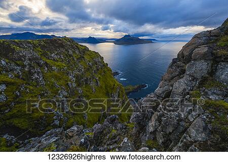 The view from the top of a sea cliff along the Strandir Coast; West Fjords, Iceland View Large Photo Image Stock Photograph - The view from the top of a sea cliff along the Strandir Coast; West Fjords, Iceland. Fotosearch