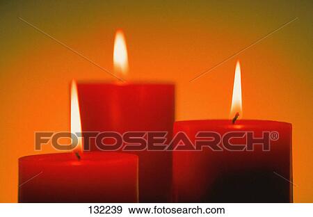 Stock Photo - Three lit candles. Fotosearch