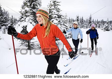 Three young women cross country skiing, Ohlson Mountain; Alaska, United States of America View Large Photo Image Stock Photograph - Three young women cross country skiing, Ohlson Mountain; Alaska, United States of America. Fotosearch
