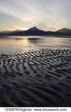 Stock Photograph - Tidal flats at sunset; Homer, Alaska, United States of America. Fotosearch