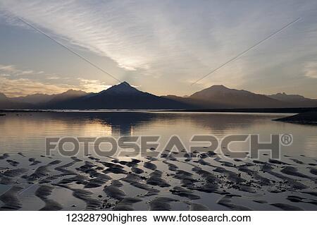 Stock Photograph - Tidal flats at sunset; Homer, Alaska, United States of America. Fotosearch