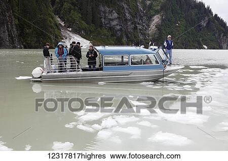 Tourists on boat at the Stikine River, Southeast Alaska, USA View Large Photo Image Stock Photograph - Tourists on boat at the Stikine River, Southeast Alaska, USA. Fotosearch