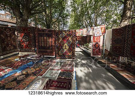 Stock Photograph - Traditional carpets for sale at the Vernissage Market; Yerevan, Armenia. Fotosearch