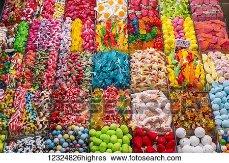 Stock Photograph - Variety of candy at Boqueria Market, one of the most famous markets around Spain and the most famous in Barcelona; Barcelona, Catalonia, Spain. Fotosearch