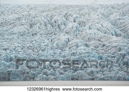 Stock Photograph - View of a glacial tongue as it comes off the of the Vatnajokull ice cap; Iceland. Fotosearch