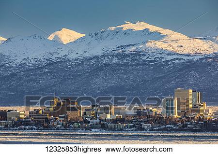 View of downtown Anchorage in winter and the snow-capped Chugach Mountains beyond seen from Point MacKenzie, the skies in the background clear and bright, sea ice covering Cook Inlet in the foreground, South-central Alaska; Anchorage, Alaska, United... View Large Photo Image Stock Photograph - View of downtown Anchorage in winter and the snow-capped Chugach Mountains beyond seen from Point MacKenzie, the skies in the background clear and bright, sea ice covering Cook Inlet in the foreground, South-central Alaska; Anchorage, Alaska, United.... Fotosearch