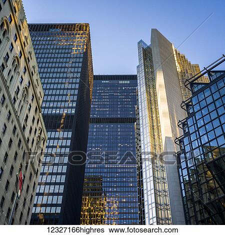 Stock Photograph - View of numerous skyscrapers with a variety of architectural styles against a blue sky; Toronto, Ontario, Canada. Fotosearch
