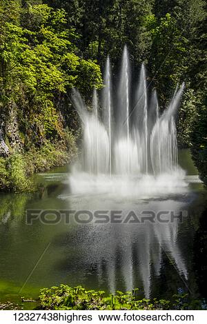 Stock Photograph - Water fountain at Butchart Gardens; Victoria, British Columbia, Canada. Fotosearch