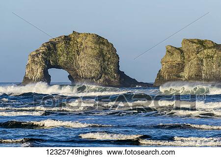 Stock Photograph - Waves break near Twin Rocks; Rockaway Beach, Oregon, United States of America. Fotosearch
