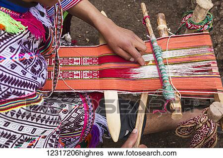 Stock Photograph - Weaving with traditional patterns in Amaru community of Sacred Valley near Urubamba; Cusco, Peru. Fotosearch