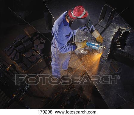Welder using a grinder View Large Photo Image Stock Photo - Welder using a grinder. Fotosearch