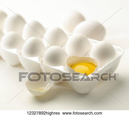 Stock Photograph - White eggs in a styrofoam carton on a white background. Fotosearch