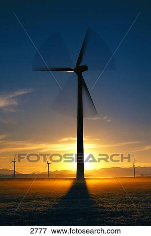 Stock Photo - Wind turbines at sunset. Fotosearch