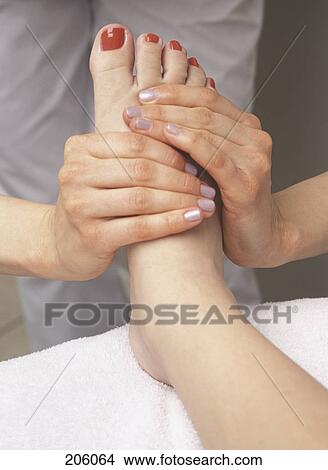 Picture - Woman getting foot massage. Fotosearch