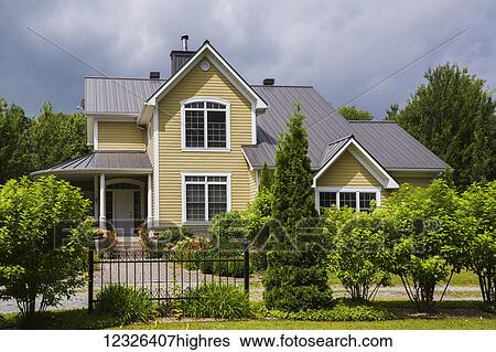 Yellow House With White Trim And Brown Metal Roof Country Cottage