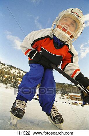 Young boy in hockey gear View Large Photo Image Stock Image - Young boy in hockey gear. Fotosearch