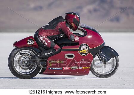 Stock Photograph - 1350cc motorcycle class MPS-G, a 2015 Indian 1300cc trys to break 223. 237 mph record on Bonneville Salt Flats during Bonneville Speed Week 2017; Wendover, Utah, United States of America. Fotosearch