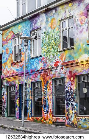 Stock Photograph - A beautiful, artistically painted building in downtown Reykjavik, typical of the artsy neighbourhoods that have many grafitti and art covered buildings; Reykjavik, Iceland. Fotosearch