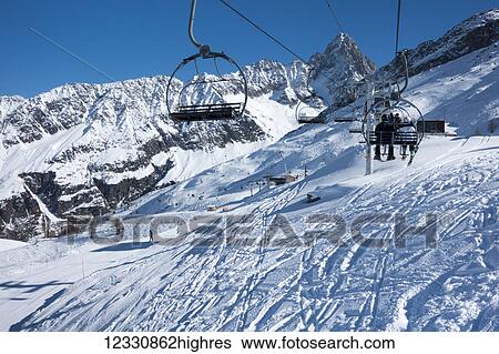 A Chairlift At A Ski Resort, Aiguille Ges Grands Montets; Chamonix, France View Large Photo Image Stock Photograph - A Chairlift At A Ski Resort, Aiguille Ges Grands Montets; Chamonix, France. Fotosearch