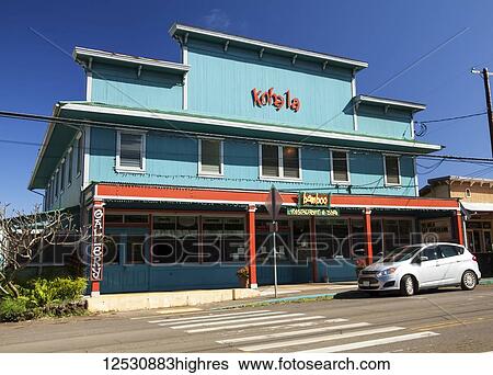 Stock Photograph - A colourful restaurant building, Bamboo, a renovated storefront in North Kohala; Hawi, Island of Hawaii, Hawaii, United States of America. Fotosearch