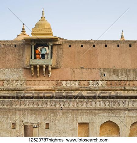 A couple stands on a small balcony in Amer Fort; Jaipur, Rajasthan, India View Large Photo Image Stock Photograph - A couple stands on a small balcony in Amer Fort; Jaipur, Rajasthan, India. Fotosearch