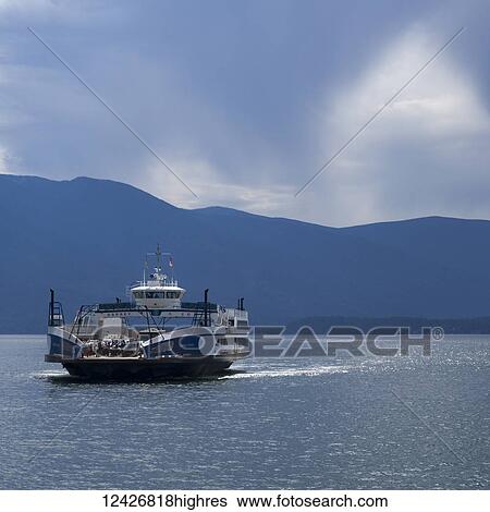 A ferry transports vehicles and people across Kootenay Lake from Kootenay Bay to Balfour; Sanca, British Columbia, Canada View Large Photo Image Stock Photograph - A ferry transports vehicles and people across Kootenay Lake from Kootenay Bay to Balfour; Sanca, British Columbia, Canada. Fotosearch