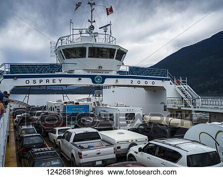 A ferry transports vehicles and people across Kootenay Lake from Kootenay Bay to Balfour; Sanca, British Columbia, Canada View Large Photo Image Stock Photograph - A ferry transports vehicles and people across Kootenay Lake from Kootenay Bay to Balfour; Sanca, British Columbia, Canada. Fotosearch