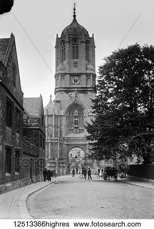 Stock Photograph - A glass negative circa 1900 of Tom Tower, a bell tower in Oxford, England, named for its bell, Great Tom. It is over Tom Gate, on St Aldates, the main entrance of Christ Church, Oxford, which leads into Tom Quad. This square tower with an octagonal.... Fotosearch