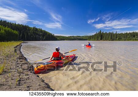 A group of kayakers paddles on the Tanana River near Delta Junction; Alaska, United States of America View Large Photo Image Stock Photograph - A group of kayakers paddles on the Tanana River near Delta Junction; Alaska, United States of America. Fotosearch