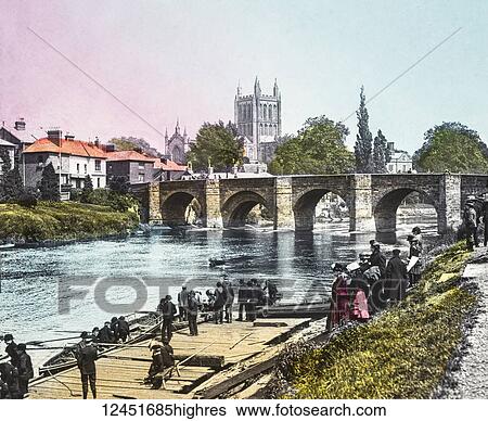 A hand coloured magic lantern slide circa 1900. Hereford Cathedral from the river Wye. People ladies and gents playing in rowing boats under the river View Large Photo Image Stock Photograph - A hand coloured magic lantern slide circa 1900. Hereford Cathedral from the river Wye. People ladies and gents playing in rowing boats under the river. Fotosearch