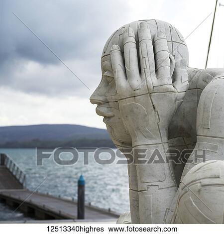 A large sculpture of a man holding his head in the Bay of Kotor; Kotor, Monte View Large Photo Image Stock Photograph - A large sculpture of a man holding his head in the Bay of Kotor; Kotor, Monte. Fotosearch