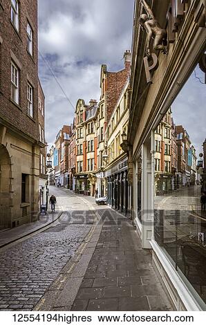 A narrow, cobbled street with window reflections, one of the few remaining areas of cobbled streets in the city, High Bridge, Newcastle upon Tyne; Newcastle Upon Tyne, Tyne and Wear, England View Large Photo Image Stock Photograph - A narrow, cobbled street with window reflections, one of the few remaining areas of cobbled streets in the city, High Bridge, Newcastle upon Tyne; Newcastle Upon Tyne, Tyne and Wear, England. Fotosearch