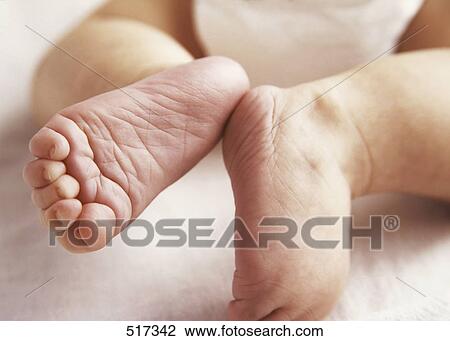 Stock Image - A pair of baby's feet. Fotosearch