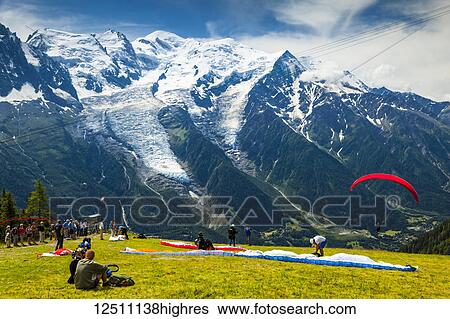 A paraglider jumps off from Plan Praz, Aiguilles Rouges, with Mont Blanc in the background; Chamonix-Mont-Blanc, Haute-Savoie, France View Large Photo Image Stock Photograph - A paraglider jumps off from Plan Praz, Aiguilles Rouges, with Mont Blanc in the background; Chamonix-Mont-Blanc, Haute-Savoie, France. Fotosearch