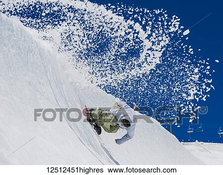 Stock Photograph - A professional, freeriding snowboarder at High Cascade Snowboard Camp, Mount Hood; Oregon, United States of America. Fotosearch