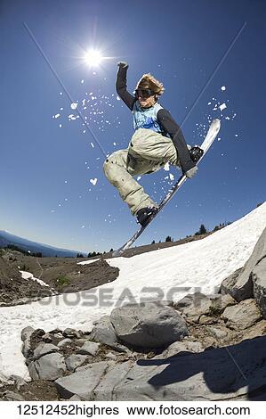 A professional, freeriding snowboarder mid-air on Mount Hood; Oregon, United States of America View Large Photo Image Stock Photograph - A professional, freeriding snowboarder mid-air on Mount Hood; Oregon, United States of America. Fotosearch