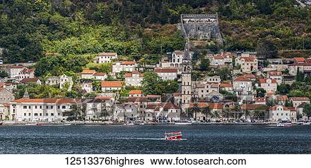 A small ferry boat in the Bay of Kotor with old buildings along the coastline; Lepetane, Monte View Large Photo Image Stock Photograph - A small ferry boat in the Bay of Kotor with old buildings along the coastline; Lepetane, Monte. Fotosearch