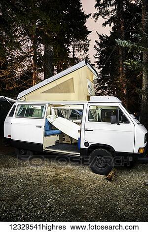 Stock Photograph - A Surfboard In A Camper Van, Mackenzie Beach; Tofino, British Columbia, Canada. Fotosearch