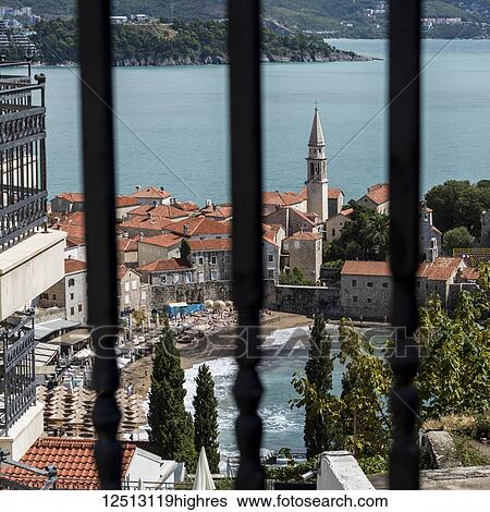 A swimming pool at a resort and rooftops in the coastal town of Budva; Budva, Budva Municipality, Monte View Large Photo Image Stock Photograph - A swimming pool at a resort and rooftops in the coastal town of Budva; Budva, Budva Municipality, Monte. Fotosearch