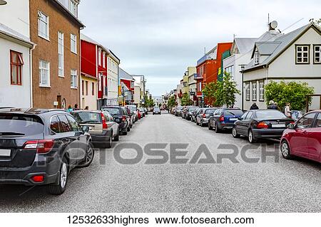 Stock Photograph - A typical quiet, pristine, colourful street of shops and homes in downtown Reykjavik; Reykjavik, Iceland. Fotosearch